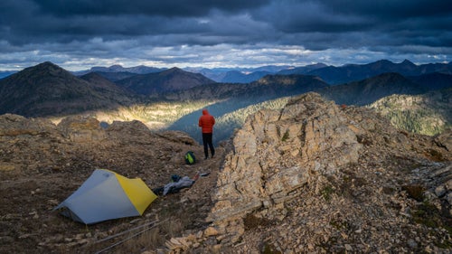 Squeezing three guys into a one-and-a-half-man tent wasn't the most enjoyable part of the journey. But it sure helped them stay warm during whiteouts on ridges, a common autumn scene in the Northern Rockies. During dry nights—like this one on Montana's Swan Crest—the runners spread out to sleep alone.