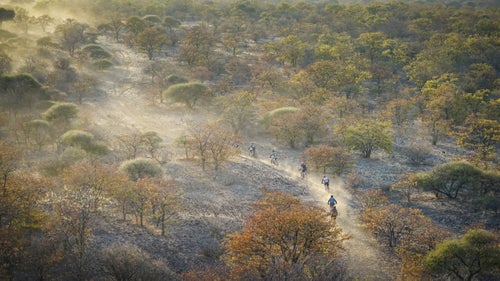 There were no markers showing us where to go. Just other riders’ tracks, GPS, a sat-phone for each team of 15 to 20, walkie-talkies, and an evac helicopter overhead, which doubled as a lookout for elephant herds. “Don’t worry about getting lost,” Friedman told me, “because that’ll mean you can get an extra dozen miles in.”