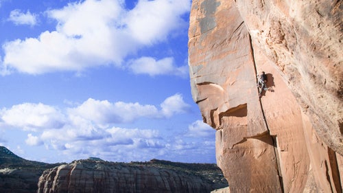 While most of us were waiting in airport security and Thanksgiving traffic, a couple hundred climbers were heading south to Indian Creek, Utah. The Creek, 40 miles south of Moab, is a crack-climbing mecca, chock-full of legendary routes for those willing to suffer.
For the past decade or so, Thanksgiving has brought those masochists out in force, coming together to bloody their knuckles on gritty sandstone and split pumpkin pies pulled out of dumpsters. The gathering, informally dubbed Creeksgiving, is a last hurrah of sorts, a chance to climb a few more pitches in the sun before trading climbing shoes for ski boots—or at least crampons.
Bozeman-based photographer and climber Seth Langbauer was back this year for his third Creeksgiving, drawn to the red rock desert to log one last week of climbing before the snow started to fly. “There’s no service, so there’s this whole little beatnik climbing community communicating through notes left at message boards,” he said. “Everyone’s down there for the same reason: to hang out in the sun and climb cracks.”
Photo: Crack climbing is just what it sounds like: Climbers use special techniques to follow fissures up a wall. Indian Creek is home to a range of crack sizes, from those just big enough for a fingertip to chimneys wide enough to crawl inside and shimmy up. Looking for a break from hand cracks, climber Jake Woodland, who’s been living in his car while traveling from crag to crag, jumped into the wide crack of Big Baby. To inch up the 5.11 route, Woodland had to wedge entire limbs into the crack, topping out with bloody knees and elbows. Said Langbauer, “Shorts were a bad choice.”