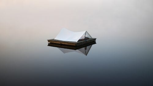 My family has been going to this small lake is East Texas for years. The water typically stays glassy like this still until 10 or 11 a.m. and on this day in May, the fog was heavy. I drove to Walmart the night before, bought a king size bed sheet for $4.96, and made this shelter the next morning. I planned on sleeping out there, but the fog quickly drenched my sleeping bags.