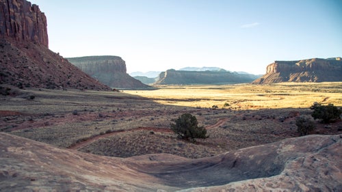 It’s hard to beat the morning commute in the Creek. Along the dirt roads to that morning’s crag, the sun hit the red-rock desert, turning it gold.