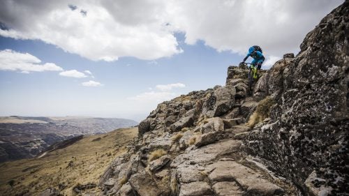 In late February, I went with a small team of mountain bikers, including MTB World Cup champ Kamil Tatarkovic and pro mountain bike racer Sarah Leishman, on an expedition to the Simien Mountains of northern Ethiopia. The stated goal was to summit the country’s highest peak, 14,928-foot Ras Deshan, and ride back down.
The expedition was a terrible idea, mostly because the trails were sometimes about as rideable as cocaine-addled donkeys. There were 1,500-vertical-foot hike-a-bikes—both up and down. Every single one of us went over the bars. The crew caught dozens of scrapes, a softball-size contusion, a festering eye infection, and stitches in the chin. And day after day, we were half-wheeled and passed by muleteers and local marathon runners.
And yet our Giro-sponsored group made the trip’s high point and found some incredible singletrack along the 10-day route. We saw some of the world’s wildest and most untamed mountains, shared trailside injera with villagers who spoke only Amharic, were chased by exuberant children at almost every turn, learned the Ethiopian national shoulder dance (badly!), and pedaled our bikes in places that few people will ever be lucky enough to experience.