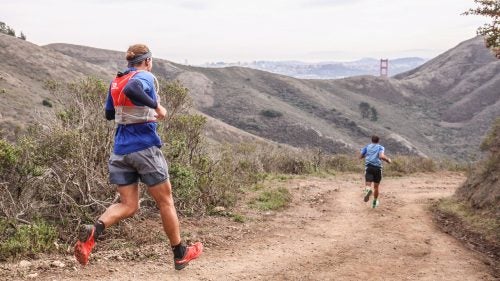 Racers getting a glimpse of the Golden Gate Bridge on the final descent to the finish line.