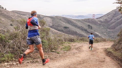 Racers getting a glimpse of the Golden Gate Bridge on the final descent to the finish line.
