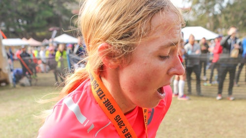 50 Mile female winner Megan Kimmel takes a second to catch her breath at the finish line.