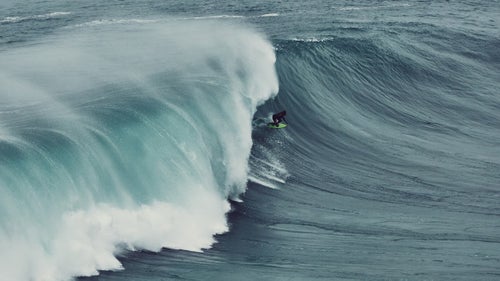 Hawaii’s Kealii Mamala catches a relatively small wave in Nazaré. No matter how big the wave is, Silva says that many of these surfers have a tendency to knock at least ten feet off their estimate. That modesty “can be a bit ridiculous, to be honest,” says Silva.