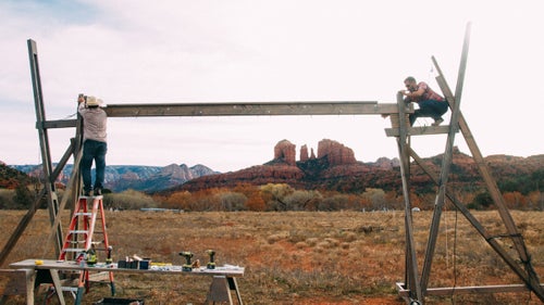 Collins and a local contractor built a structure that stands 20-feet wide by 12-feet tall, on which they hung windows collected from the Habitat for Humanity Restore and through Craigslist. “I’m looking through the windows into the Sedona desert, so these beautiful towers are not only beyond the art, but are part of the art.”