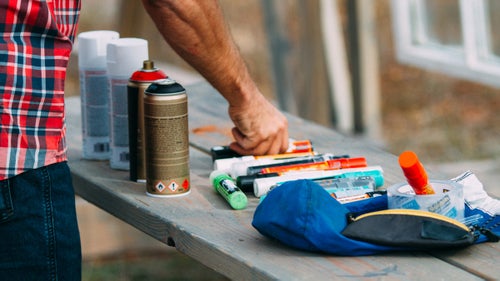 Collins used street art materials to paint on the glass: spray paints and acrylic markers.