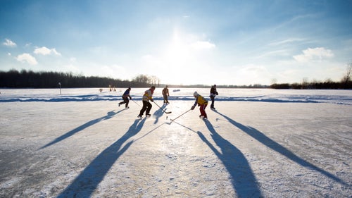 When the temperature drops, hardcore hockey players around the world leave behind climate-controlled rinks and return to the frozen ponds where the sport was born. Northland Films created an award-winning ode to these hallowed grounds in the 2008 documentary 'Pond Hockey'. Earlier this month, the Great Lakes-based production company released a follow-up photo book called 'Pond Hockey: Frozen Moments'. The 128-page anthology includes shots by photographers based everywhere from Denali to Helsinki, a testament to the sport’s global popularity—and a reminder that hockey still shines away from the bright lights of today’s rinks.
“There's just something to being outside and playing with your friends that you can’t beat,” says Tommy Haines, co-partner of Northland Films. “The speed and the wind and being surrounded by mountains—we wanted to celebrate that.”
Photo: The majority of shots in the book came from Nicholas Wynia, a freelance photographer based in Iowa City. Wynia spent three and a half weeks driving 6,000 miles through Canada, up the East Coast, and back along the Great Lakes—in a rental Nissan Maxima without snow tires, no less. While he drove, the Northland Films team was back in Iowa City, scouring Facebook for local pond hockey teams and rinks. On Acorn Pond in Fredonia, New York, 50 miles outside of Buffalo, Wynia met a team of middle-aged chargers who still travel to local pond hockey tournaments in their beloved ramshackle RV.