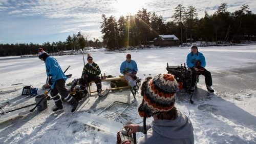 Scott Crowder (grey sweatshirt), the son of former Boston Bruins player Bruce Crowder, founded the Pond Hockey Classic, a series of tournaments held across the country, from Kalispell, Montana, to New York City. This game in Meredith, New Hampshire, kicked off with beers on the ice, but most of the crew has played competitively, and the heckling started as soon as the puck dropped.