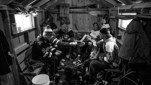 Players take a break in a warming house. These teenagers were in Winchester, Ontario, as part of a hockey exchange program, since they have aspirations to play professionally. “They were like heroes to the little kids out on the ice,” says Wynia.