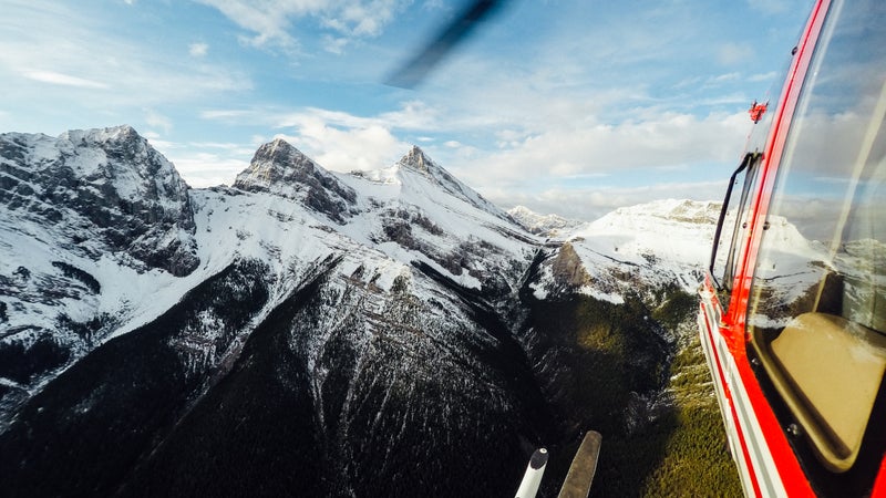 Alpine Helicopters flew our party over the Three Sisters in Canmore, Alberta—en route to Marvel Pass for a backcountry camping trip.