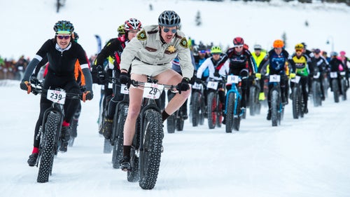 Last week, 260 racers lined up to compete in Crested Butte’s inaugural Fat Bike World Championships. The race is a world championship in name only, as it’s not sanctioned by cycling’s international governing body, the UCI, but we don’t care: the photos from the event make it look like about the most fun you can have on two wheels. Like all the very best bike races, this one attracted lots of crushers (including pro roadie Robbie Squire), without taking itself too seriously (note the Fat Bike Worlds branding iron, copious number of kegs, and costumed riders). Professional photographer Eddie Clark went to the comp for us and came back with these 13 shots of fatties in their element.
Photo: Elite men’s racer and Crested Butte local Jordan Williford, from the Brick Oven, laid down the law early, stringing the field out from the starting line.