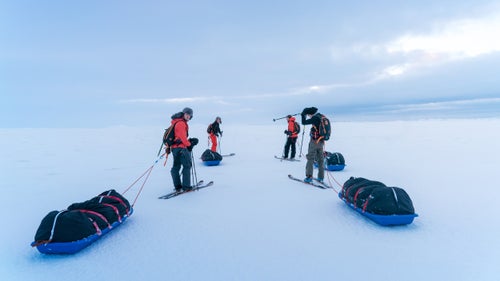 December 4: After being shuttled north, the team set out from the nation’s northernmost point, Rifstangi, dragging heavily laden pulks across a snowy plain. As the wind picked up and temperatures fell, Angus (far right), quietly fell ill.