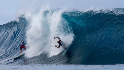 Even with his amazing contest run, Kelly Slater (right) got caught a few times. To his left, Jack Robinson negotiates the Backdoor section.