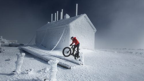 In early February, pro cyclist Tim Johnson became the first person to pedal to the top of New Hampshire’s 6,288-foot high Mount Washington in the dead of winter. The Auto Road he took up is closed during the cold months, and it’s easy to see why: the environment becomes encased in ice, and resembles Antarctica more than the Northeast.*
The mountain’s 7.6-mile Auto Road was created in 1861 and is billed as “America’s first and oldest man-made attraction.” Johnson, a six-time Cyclocross National Champion, cranked up a 12 percent grade slope and arrived at the summit in 1:45:48 on a day when the average temperature was 13 degrees and winds were gusting at 41 miles per hour.
Photo: Johnson, from Massachusetts, is familiar with the Auto Road. He first visited Mount Washington as a kid, then started competing in the Mount Washington Hill Climb race when he was 17 years old “and was able to use it as a stepping stone to turn pro,” he told Red Bull. He won the race in 2000 and 2001. But the race is held in late summer, in more bike-friendly conditions.
CORRECTION: An earlier version of this article incorrectly stated that Mount Washington is closed in the winter months. It has been clarified that the Auto Road is closed in the winter months.
