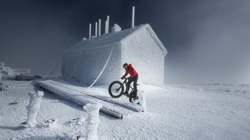 In early February, pro cyclist Tim Johnson became the first person to pedal to the top of New Hampshire’s 6,288-foot high Mount Washington in the dead of winter. The Auto Road he took up is closed during the cold months, and it’s easy to see why: the environment becomes encased in ice, and resembles Antarctica more than the Northeast.*
The mountain’s 7.6-mile Auto Road was created in 1861 and is billed as “America’s first and oldest man-made attraction.” Johnson, a six-time Cyclocross National Champion, cranked up a 12 percent grade slope and arrived at the summit in 1:45:48 on a day when the average temperature was 13 degrees and winds were gusting at 41 miles per hour.
Photo: Johnson, from Massachusetts, is familiar with the Auto Road. He first visited Mount Washington as a kid, then started competing in the Mount Washington Hill Climb race when he was 17 years old “and was able to use it as a stepping stone to turn pro,” he told Red Bull. He won the race in 2000 and 2001. But the race is held in late summer, in more bike-friendly conditions.
CORRECTION: An earlier version of this article incorrectly stated that Mount Washington is closed in the winter months. It has been clarified that the Auto Road is closed in the winter months.