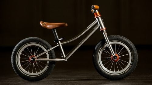 The nicest kid’s bike around, the Triton
Mitrich is a custom titanium Strider-style ride with a Chris King headset and hubs on 12-inch wheels.
