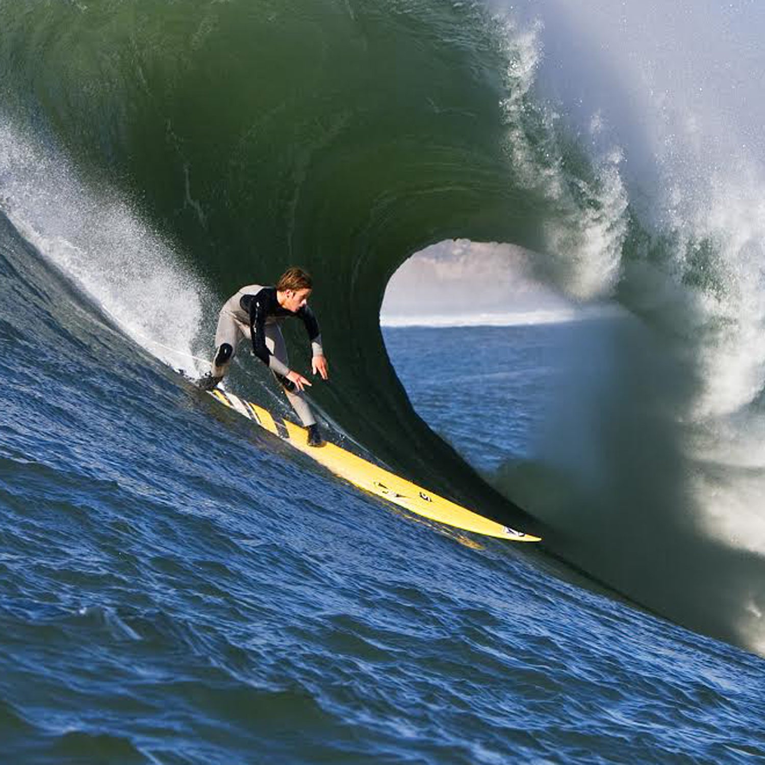 Santa Cruz native Nic Lamb races down the face of a Maverick's wave.