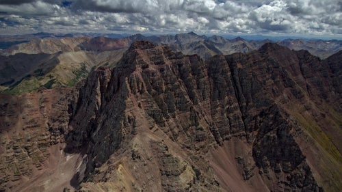 “Winds three miles from here were just fine. But crossing over Maroon Peak (14,156’), a sudden downdraft appeared. The safest option was to fly directly toward the peak and skim the ridge to the right to get back to safer territory. My guess was that the winds on the left area of this image were blowing straight down, while on the righthand ridge they would be turbulent, mixed up, and blowing upward at the lip of the ridge. The scary reality was that I could only confirm by flying right into it.”