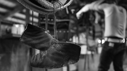 Lanolin, the natural wax secreted by wool bearing animals, greases the floors of shearing sheds, so shearers have to wear special moccasins with a non-slip coating for solid footing.