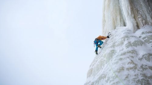 Anker kicks into the base of a large pillar of ice called Dairy Land.