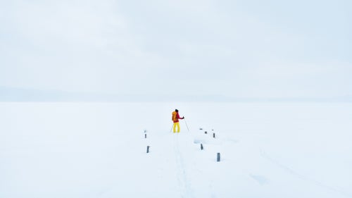 Pohl stands on the dock near the East Channel Lighthouse looking out on a snow covered and frozen Lake Superior. The local guides from the Upper Peninsula, who referred to themselves as UPers (pronounced “yoopers”), assured the team that it’s safe to travel on the ice, so long as it’s at least 6 iches thick.