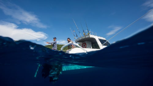 Jonathan and Aidi cast along a promising drop-off not far from a small island while I shot from some distance off in the water. No fish came to play, but while editing that night, I noticed in the next camera frame a decent-size fin along the bottom of the image.
