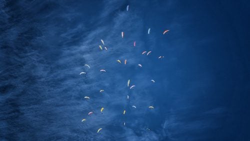 Over the winter, Matt Segal and I—both professional climbers and beginner paragliders—headed down to Mexico with the pie-in-the-sky goal of flying off of Pico de Orizaba. At 18,400 feet, the volcano is the highest peak in Mexico, and third highest in North America.
We stayed in world-class paragliding destination Valle de Bravo, known for it’s consistent and adventurous flying conditions. We waited in Valle for a weather window to fly off Orizaba, which was tough given that a “100-year storm” was buffeting the volcano with 80 mph winds and copious snow. But towards the end of our month in Mexico, winds subsided and Matt and I, along with our paragliding instructor, Matt Henzi, climbed up and flew off of Pico de Orizaba. Not bad for less than a year of paragliding! “Better lucky than good,” as I like to say!
I directed a short film of the adventure called The Fledglings, which was sponsored by the North Face. A longer, uncut version will hit film festivals this summer.
Photo: In training for Pico de Orizaba, Segal and I enter a “gaggle” of 30 paragliders all circling up in one thermal. A thermal is a mass, bubble, or column of rising air traveling upward from the ground.