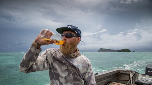With temperatures ranging close to 100 degrees every day and an undrinkable water supply, bottled water and juices are critical rations. While outrunning a storm and hunting for giant trevally, Jonathan fuels up on Samoan orange juice, which is sweeter than what most of us are accustomed to. Downing drinks on a choppy day is an acquired talent.