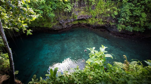To-Sua Ocean Trench, or just “The Trench,” as the locals call it, consists of two giant holes joined by a lava tube cave. The pool, almost 100 feet down, is accessed by a steep, slick ladder not for the faint-hearted. Strong currents mean the pool is limited to strong swimmers, though a few ropes offer guidance for the less confident. After stepping off a plane and 40 hours travel, within two hours I was submerged in the Trench.