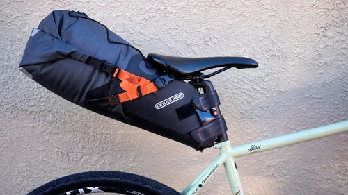 Ortlieb isn’t the first company to make a gravel-adventure bag setup, but its new rackless bike sacks are some of the best we’ve seen. The seat bag ($160) holds eight to 16 liters of gear, and, thanks to welded zippers and water-resistant fabric, it’ll keep your stuff dry in a downpour. It also has it's own purge valve that lets you compress the bag.