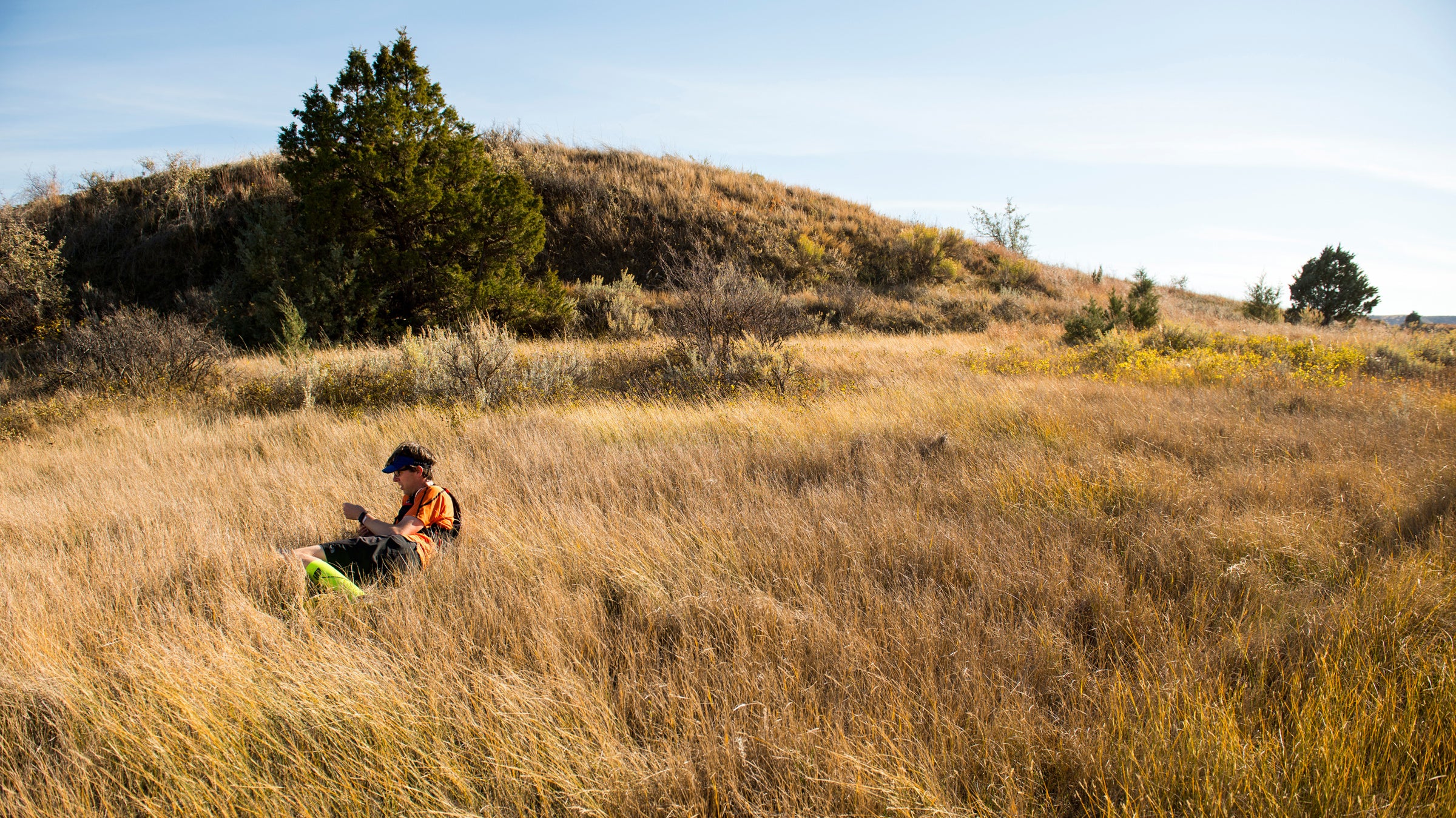 Tim Neville rests in the Grasslands of North Dakota during his 4-day adventure through Theodore Roosevelt National Park and the Maah Daah Hey Trail.
