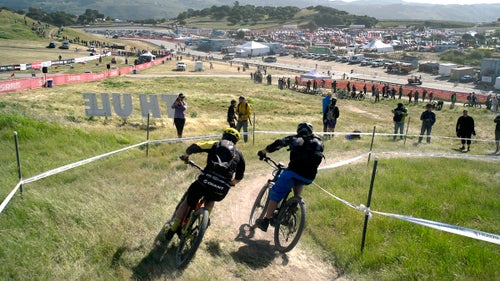 Last weekend, the Sea Otter Classic, an annual event in Monterey, California, that celebrates the arrival of bike season, held the first-ever large-scale eMTB race. Participants rode motorized whips around a 1.5-mile course for 60 minutes and competed either in the men’s (by age), women’s (by age), or industry category. All the bikes had to be pedal-assist (no throttles), with just one battery (no mid-race swaps). Some riders took the event seriously and tried for the win, while others donned costumes and just tried to finish. In the end, Christoph Sauser, a former mountain bike world champion, landed on top of the podium. “It was something completely different,” he says. “It was as hard as any cross-country race I’ve ever done. The pacing is just a little… different.” Photo: Two riders rip the big S-curve leading into the finishing straight.
