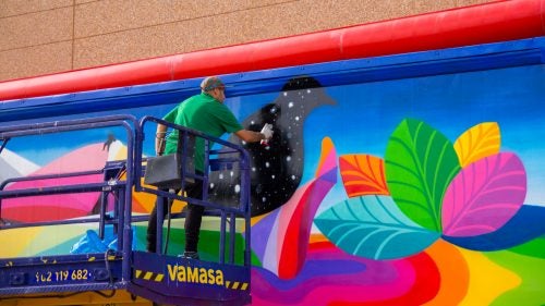 The other side of San Miguel’s truck features a colorful landscape scene. Some of the trucks will feature art on the inside, acting as mobile galleries for a handful of the artists.