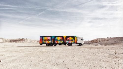 Long hauls to the mountains can get boring. More often than not, any beautiful landscape outside the car window is blocked by a huge serving of McDonald’s fries plastered on the side of a semi-truck. Now, a new project in Spain is transforming these eyesores into something people will actually want to look at. For the Truck Art Project, some of Spain’s best contemporary artists are partnering with commercial shipping company Palibex to convert 100 out-of-service trucks into moving canvases. The project launched with 10 trucks this February, with plans to introduce more this year.
Photo: One of the trucks designed and painted by the Madrid-based artist Okuda San Miguel. San Miguel started as a street artist and gained a quick following for his style of multicolored geometric structures, which he calls pop surrealism.