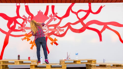Artist Marina Vargas works on the early stages of her truck design. She focuses heavily on exploring the meaning of religious or magical symbols, and her artwork often involves organic elements like blood and veins.