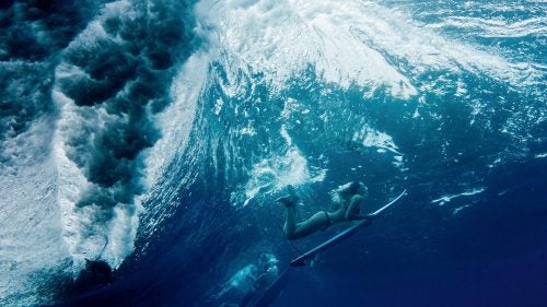 Surfing is rife with stereotypes of laid-back, tanned athletes in tropical locales. But go beyond the surface and you’ll find some of the most interesting subcultures in sport, from bike-and-surf gangs to teenage girls who ride in Bangladesh. Not to mention, where there are waves to ride, there is very often someone who has tried, no matter how unusual the location. Surfer, designer, and illustrator Andrew Groves gathered unexpected imagery of these dedicated wave-hunters (plus board-shapers and artists) for Surf Odyssey, a new coffee table book. The result is an atypical surf book that’s more than just nice to look at (though it is that, too). Featuring some of the best photographers in the world, Surf Odyssey dives deep into the secret worlds that develop around a passion for waves. Photo: Lee’s mesmerizing, balletic images of surfers and swimmers above and below the water are shaped by her own childhood growing up by the sea and by her adult life as a surfer and long-distance swimmer. Many of her photographs are shot through with vibrant, jewel-like colors that amplify the elegance of the figures as they drift through their adopted aquatic home.