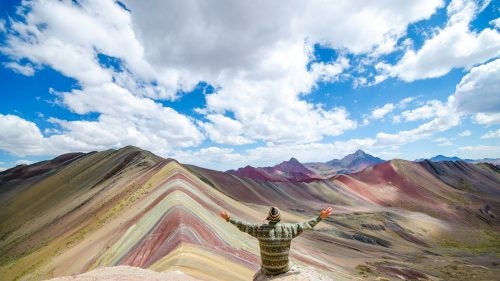 A year ago, Brandon and LeAnn Morris decided to quit their jobs in Seattle and hit the road. Not an uncommon premise for anyone that follows any adventurous Instagram accounts, but they actually did it. Six months of passport stamps from Nepal, Thailand, New Zealand, Japan, Chile, and the list goes on. Through all of their adventures, Peru emerged as one of the couple’s favorites and particularly the Ausangate trek, which led them to the striated Vinicunca Mountains and eventually their next job. The duo has since started the travel business FlashpackerConnect, which leads trips out of Cusco, with the rainbow mountains being their featured trip. Five days of high altitude trekking and you are rewarded with this view. Here, a preview of what you might see along this relatively undiscovered trail.
Photo: Typically a five-day trip, the Ausangate trek meanders through the Andes and around the 20,000-foot Ausangate mountain—the highest in the region.