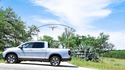 The 2017 Honda Ridgeline is a bit like a Subaru Outback with a truck bed. Like the classic Subie, it drives like a car but still has plenty of off-road features, such as multiple terrain modes in the 4WD system and nearly eight inches of ground clearance, as well as auto hill-holding when you’re rock crawling. It looks more like a normal pickup than the original Ridgeline (which Honda discontinued in 2014). Honda wants to be a challenger in the midsize truck market currently dominated by Toyota, Nissan, and Chevy. We recently drove the new truck in Texas. Here are our initial thoughts on how it stacks up against the competition.