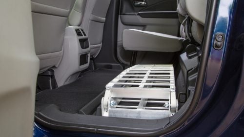 With the rear seats folded down, the Ridgeline easily accommodates two mountain bikes with the front wheels removed. The back row is a squeeze (a 6’2” tester couldn’t comfortably sit behind the driver), but this space is still roomier than that in the Tacoma or Colorado.
