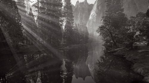 Another early morning on the Merced River was enhanced by smoke in the air from a nearby controlled burn, which made every ray of light visible as they shot through the trees.