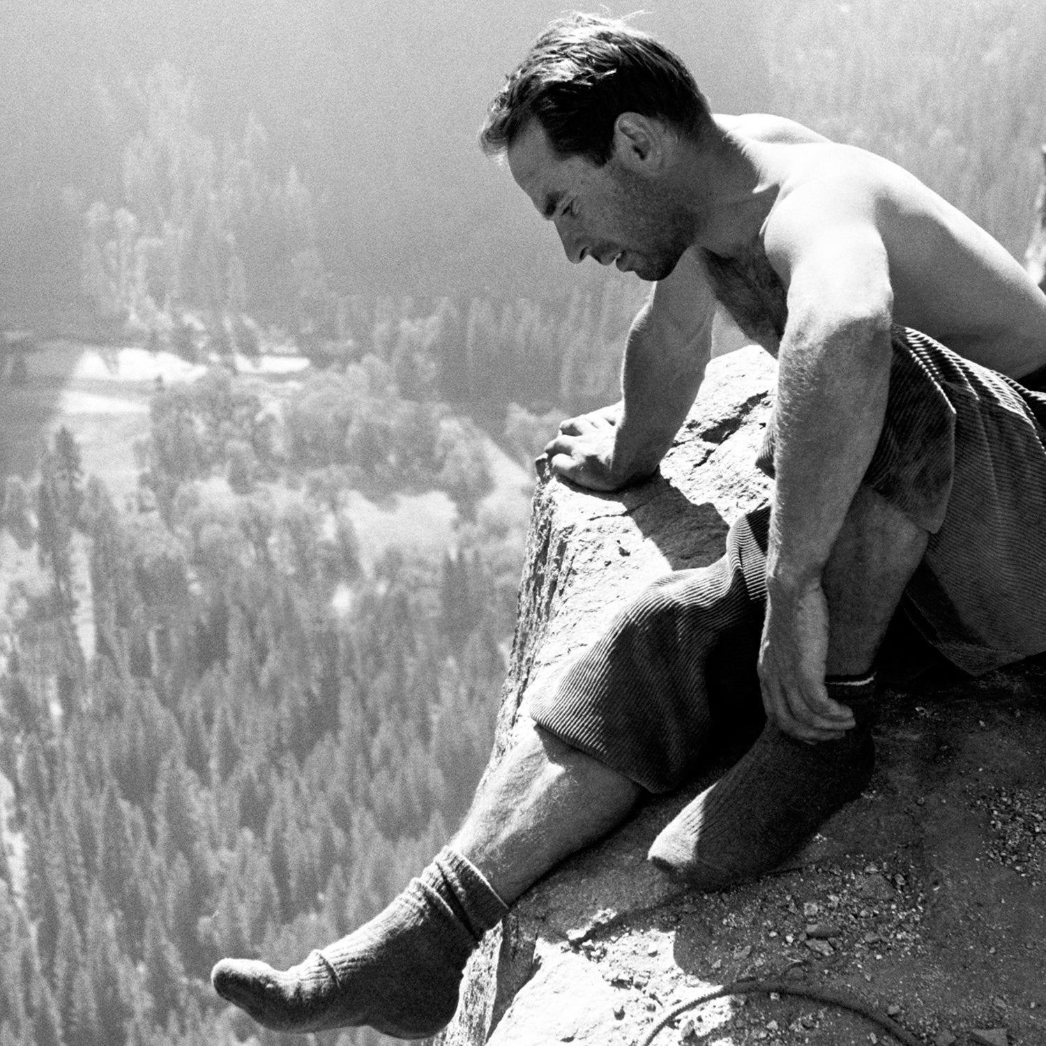 Yosemite climbing pioneer Yvonne Chouinard checking out the view from Big Sur ledge the first ascent of the North America Wall on El Capitan. End of pitch 11, Fall 1964.