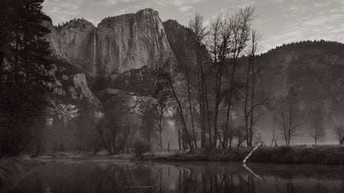 While walking early one morning along the Merced River, I was drawn to this broken log and its reflection on the horizon line as fog drifted through Yosemite valley.