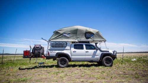 Jon Burtt, 32, runs a food truck out of an old Airstream in Denver, Colorado, but we were more interested in his 2015 Tacoma. He turned a stock TRD Off Road into the beast you see here by adding Pelfreybilt front and rear bumpers, a four-inch lift, custom drawers, and other toys like the FRP Flip-Pac camper shell.