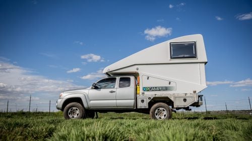 Grass Valley, California–based XP Camper makes a totally unique camper shell. The fiberglass-composite pop-up design raises with the touch of a button and is both incredibly light and aerodynamic. This Model V2, fitted to a 2006 Tacoma with a diesel engine, is armed with solar panels that generate 300 watts of power, a diesel-powered stove, and 30 gallons of water storage.