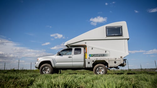 Grass Valley, California–based XP Camper makes a totally unique camper shell. The fiberglass-composite pop-up design raises with the touch of a button and is both incredibly light and aerodynamic. This Model V2, fitted to a 2006 Tacoma with a diesel engine, is armed with solar panels that generate 300 watts of power, a diesel-powered stove, and 30 gallons of water storage.