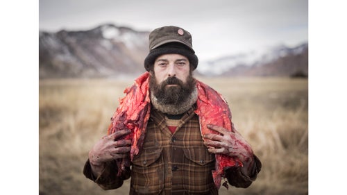 When Yellowstone National Park was created in 1872, hunting was strictly banned within it—even for the the Native Americans who had lived and hunted there for generations. It wasn’t until 2006 that the Nez Perce, Confederated Salish, and Kootenai tribes successfully petitioned the government to be able to hunt bison when they left the park and within the annually regulated cull—a federal initiative started to manage and combat bison from spreading diseases to other livestock outside the park. Every winter, groups of Native American hunters wait near Gardiner, Montana, near the park’s northwest corner, for the herd to leave the park in search of food, so the hunt can begin. Accompanying them are a group of scavengers who collectively call themselves Buffalo Bridge that live off the remains of bison from the hunt. Working with the Native American hunters, Buffalo Bridge members offer their skills and help in field dressing the animal after the kill. They are often given parts of the animal for their work. Photographer Matt Hamon spent a few days with them this winter. Photo: Buffalo Bridge see their efforts as a way of honoring the bison through education and by utilizing as much of the animal as possible. Here, Josh assists a Native American hunter as he carries a buffalo back strap from the hunting ground.
