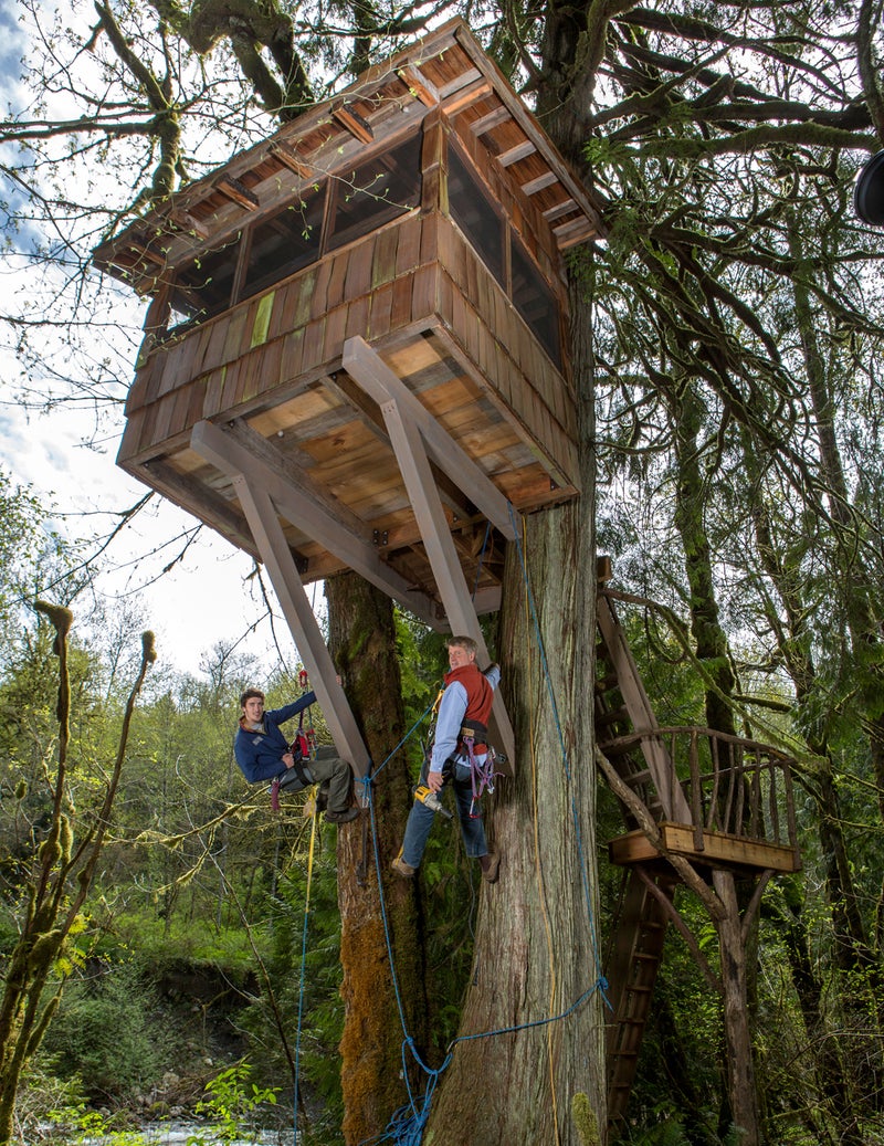 Pete Nelson and his son Charlie hang as they work on a treehouse at Treehouse Point.