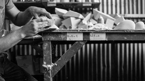Pinches. Slopers. Jugs. Baby heads? Ever stop to wonder who makes the holds bolted to the wall at your local climbing gym? These guys do. Starting with blocks of foam and working in showers of dust, they craft the pieces of the puzzles we love to solve after work and on rainy weekends.